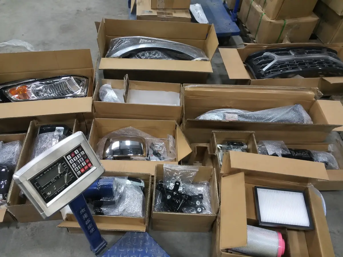 Auto parts body trim pieces inspected before overseas shipment